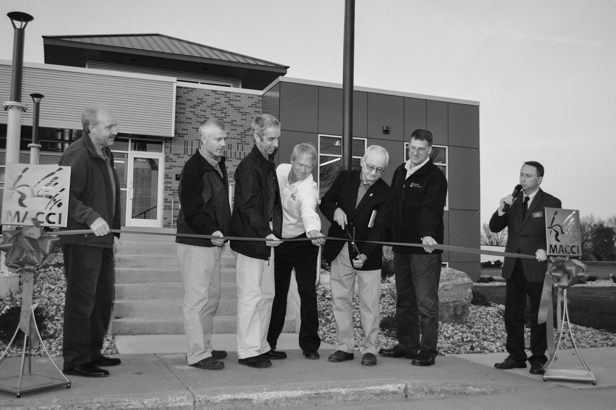 Staabco Executives cutting red tape at the expansion completion