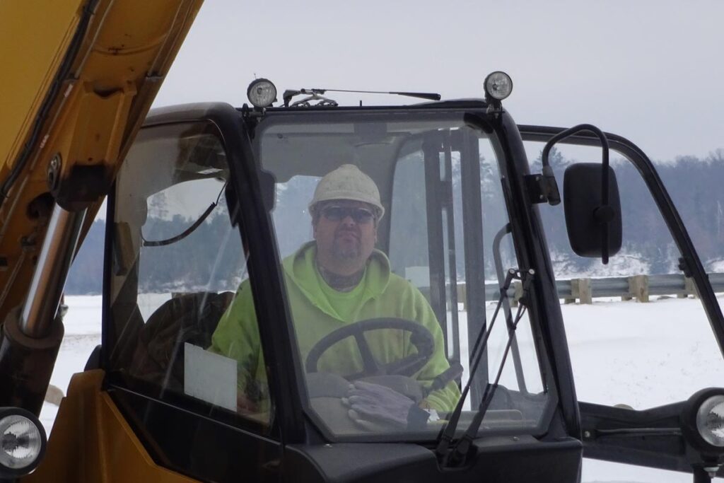 Staab employee in excavator