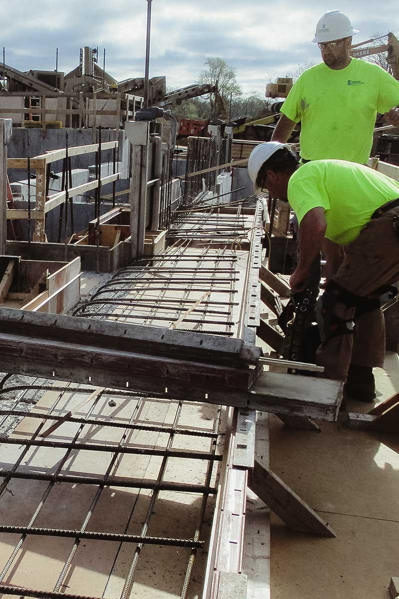 workers installing metal prices