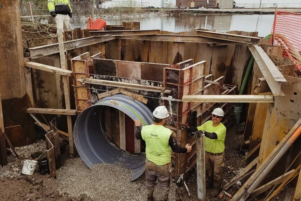 workers installing pipes