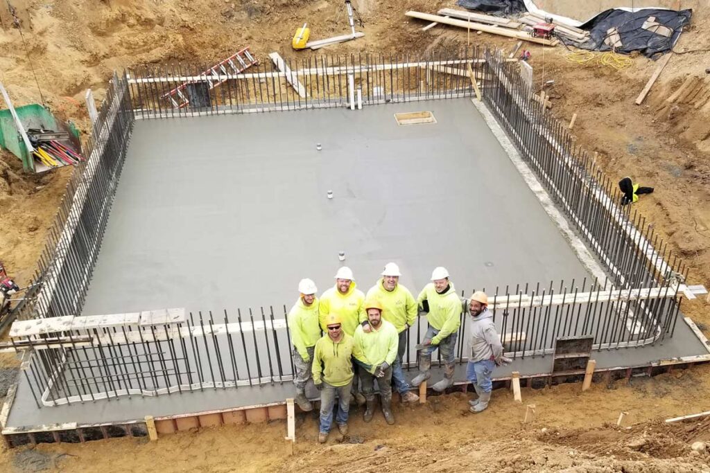 Staab employees smiling at a job site