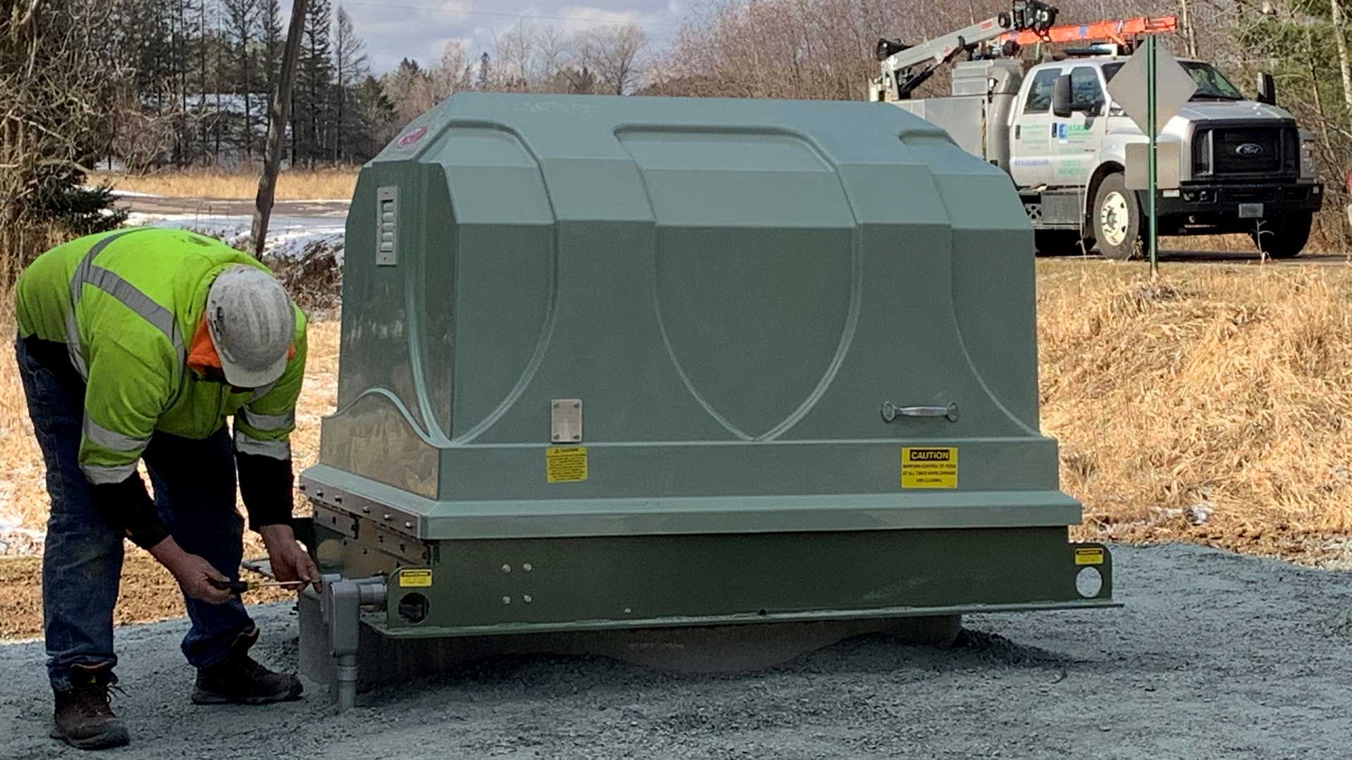 Staab employee installing new above ground package pump station