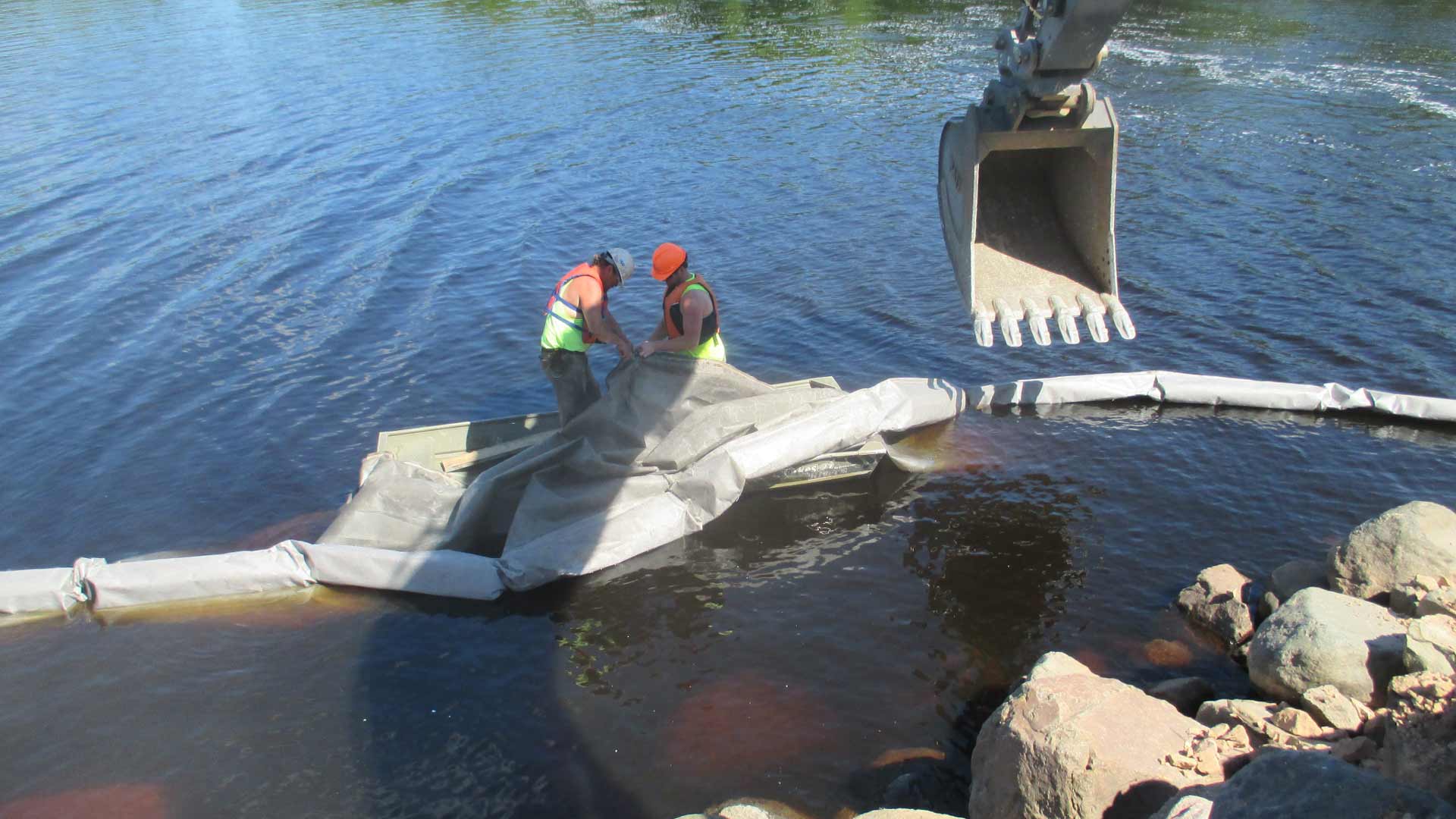 Staab employees working in the water