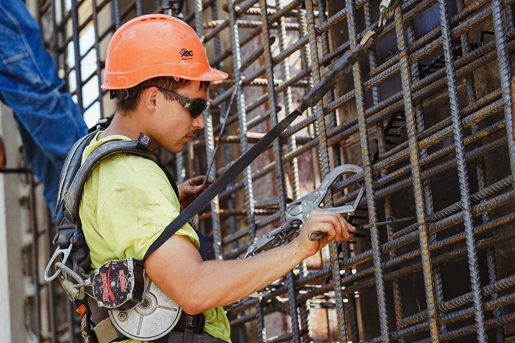 staab employee working on a wall