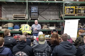 Staab employee giving a presentation to students